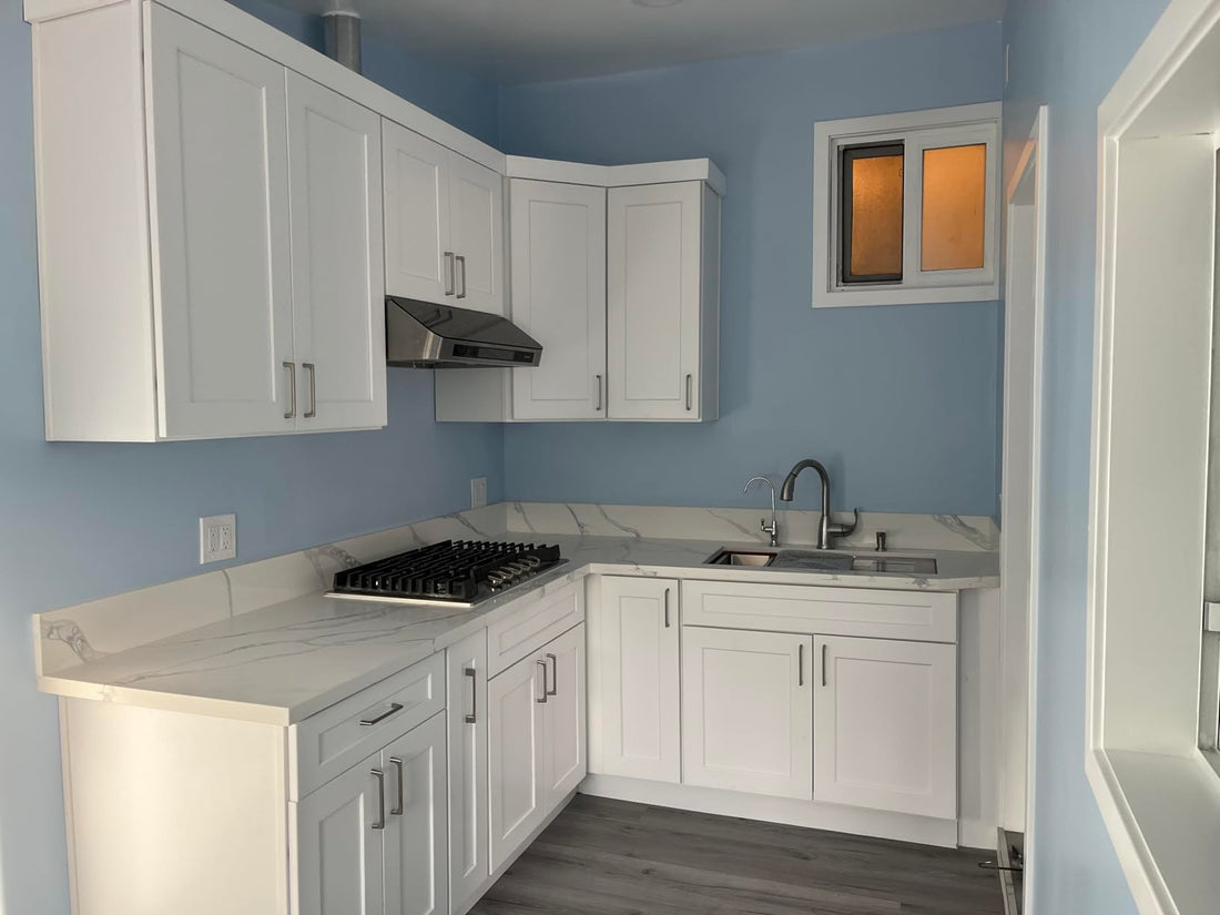Black Stainless Range Hood In White Kitchen